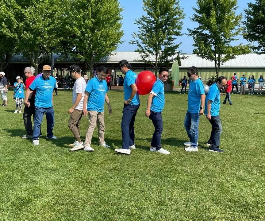 Photo of participants playing the balloon passing game